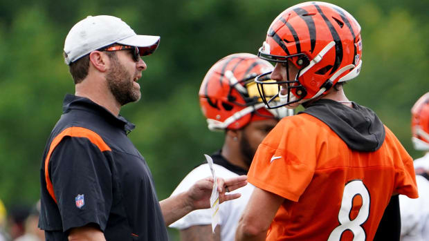 Aug 1, 2022; Cincinnati, OH, USA; Cincinnati Bengals offensive coordinator Brian Callahan, left, talks with Cincinnati Bengals quarterback Brandon Allen (8), right, during Cincinnati Bengals training camp practice, Monday, Aug. 1, 2022, at the practice fields next to Paul Brown Stadium in Cincinnati. Mandatory Credit: Kareem Elgazzar-USA TODAY Sports